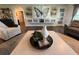 Living room with a large butterfly artwork and built in shelving at 825 E Lakeshore Blvd, Kissimmee, FL 34744