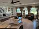 Spacious living room featuring hardwood floors and large windows at 825 E Lakeshore Blvd, Kissimmee, FL 34744