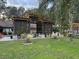 Lovely patio with pergola and lush landscaping at 825 E Lakeshore Blvd, Kissimmee, FL 34744