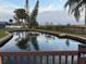 Private pond with a wooden dock at 825 E Lakeshore Blvd, Kissimmee, FL 34744