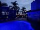 Blue illuminated pool and patio at night at 825 E Lakeshore Blvd, Kissimmee, FL 34744
