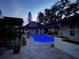 Inviting pool area with a pergola and outdoor lighting at dusk at 825 E Lakeshore Blvd, Kissimmee, FL 34744