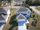 Two-story house with a garage and a yard at 945 Gateshead Ct, Kissimmee, FL 34758