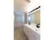 Updated bathroom with double vanity and a relaxing bathtub at 945 Gateshead Ct, Kissimmee, FL 34758