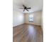 Spacious bedroom with ceiling fan and large window at 945 Gateshead Ct, Kissimmee, FL 34758