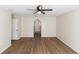 Large bedroom with arched doorway and ceiling fan at 945 Gateshead Ct, Kissimmee, FL 34758