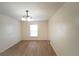 Simple dining room with light walls and wood-look floors at 945 Gateshead Ct, Kissimmee, FL 34758