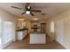 Kitchen features white cabinets, granite countertops, and island at 945 Gateshead Ct, Kissimmee, FL 34758
