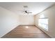 Spacious living room with large window and wood-look floors at 945 Gateshead Ct, Kissimmee, FL 34758