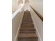 Modern staircase with wood-look laminate treads at 945 Gateshead Ct, Kissimmee, FL 34758