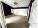 Spacious bedroom with carpeting and a ceiling fan at 1005 Tequesta Trl, Lake Wales, FL 33898