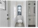 Small bathroom with toilet and vanity at 10420 Vista Del Sol Cir, Clermont, FL 34711