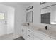 Modern bathroom with white cabinets and double vanity at 10420 Vista Del Sol Cir, Clermont, FL 34711