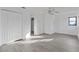 Well-lit bedroom, featuring grey vinyl flooring and double door closet at 10420 Vista Del Sol Cir, Clermont, FL 34711