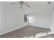 Spacious bedroom with light grey vinyl flooring and a ceiling fan at 10420 Vista Del Sol Cir, Clermont, FL 34711
