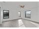Spacious bedroom with hardwood floors and multiple windows at 10420 Vista Del Sol Cir, Clermont, FL 34711