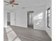 Bright bedroom with hardwood floors and access to hallway at 10420 Vista Del Sol Cir, Clermont, FL 34711