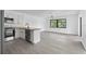 Open kitchen with island and stainless steel appliances at 10420 Vista Del Sol Cir, Clermont, FL 34711