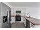 Modern kitchen with granite countertops and stainless steel appliances at 10420 Vista Del Sol Cir, Clermont, FL 34711