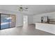 Living room with sliding doors leading to patio at 10420 Vista Del Sol Cir, Clermont, FL 34711