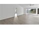 Living room with hardwood floors and large window views at 10420 Vista Del Sol Cir, Clermont, FL 34711