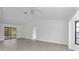 Spacious living area with high ceilings and sliding glass doors at 10420 Vista Del Sol Cir, Clermont, FL 34711