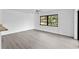 Bright living room with wood-look floors and ceiling fan at 10420 Vista Del Sol Cir, Clermont, FL 34711