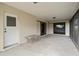 Covered screened patio with concrete flooring and exterior access at 10420 Vista Del Sol Cir, Clermont, FL 34711