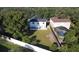 Aerial view of house and backyard with pool at 1063 Eagles Forrest, Apopka, FL 32712