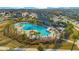 Community pool with lounge chairs and palm trees at 11120 Robert Frost Dr, Winter Garden, FL 34787