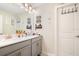 Bathroom with a double vanity and modern gray cabinets at 11120 Robert Frost Dr, Winter Garden, FL 34787