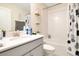 Clean bathroom with tub shower, vanity, and updated fixtures at 11120 Robert Frost Dr, Winter Garden, FL 34787