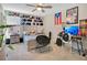 Bedroom with a desk, bed and unique hat display at 11120 Robert Frost Dr, Winter Garden, FL 34787