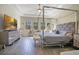 Spacious bedroom with a large bed and plenty of natural light at 11120 Robert Frost Dr, Winter Garden, FL 34787