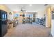 Spacious bonus room with a desk, seating area, and a retro refrigerator at 11120 Robert Frost Dr, Winter Garden, FL 34787