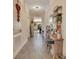 Bright and spacious entryway with wood-look floors and decorative accents at 11120 Robert Frost Dr, Winter Garden, FL 34787