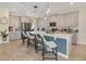Modern kitchen with island, stainless steel appliances, and ample cabinetry at 11120 Robert Frost Dr, Winter Garden, FL 34787