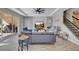 Spacious living room with large windows, hardwood floors, and a fireplace at 11120 Robert Frost Dr, Winter Garden, FL 34787