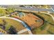 Aerial view of a neighborhood playground with slides and climbing structures at 11120 Robert Frost Dr, Winter Garden, FL 34787