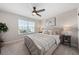 Bedroom with a large bed and neutral decor at 121 Lavenna Ave, St Cloud, FL 34771