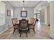 Elegant dining room featuring a large, dark wood table with multiple chairs at 12814 Westside Village Loop, Windermere, FL 34786