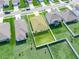 Aerial view of a house with a backyard in a residential area at 1521 Majestic Ln, Winter Haven, FL 33880