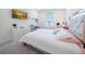 Bright bedroom with large bed and TV at 16548 Raven Rock Pl, Winter Garden, FL 34787