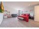 Spacious bedroom with a king-size bed and seating area at 16548 Raven Rock Pl, Winter Garden, FL 34787