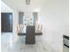 Bright dining room with modern chandelier and large table at 16548 Raven Rock Pl, Winter Garden, FL 34787