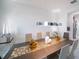 Elegant dining room features a modern chandelier and a large table at 16548 Raven Rock Pl, Winter Garden, FL 34787