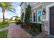 Landscaped walkway leading to a double-door entry with stone accents at 16548 Raven Rock Pl, Winter Garden, FL 34787