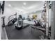 Well-equipped home gym with various exercise machines at 16548 Raven Rock Pl, Winter Garden, FL 34787