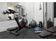 Home gym with exercise bike and weight equipment at 16548 Raven Rock Pl, Winter Garden, FL 34787