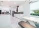 Bright kitchen with white cabinets, marble floors, and breakfast nook at 16548 Raven Rock Pl, Winter Garden, FL 34787